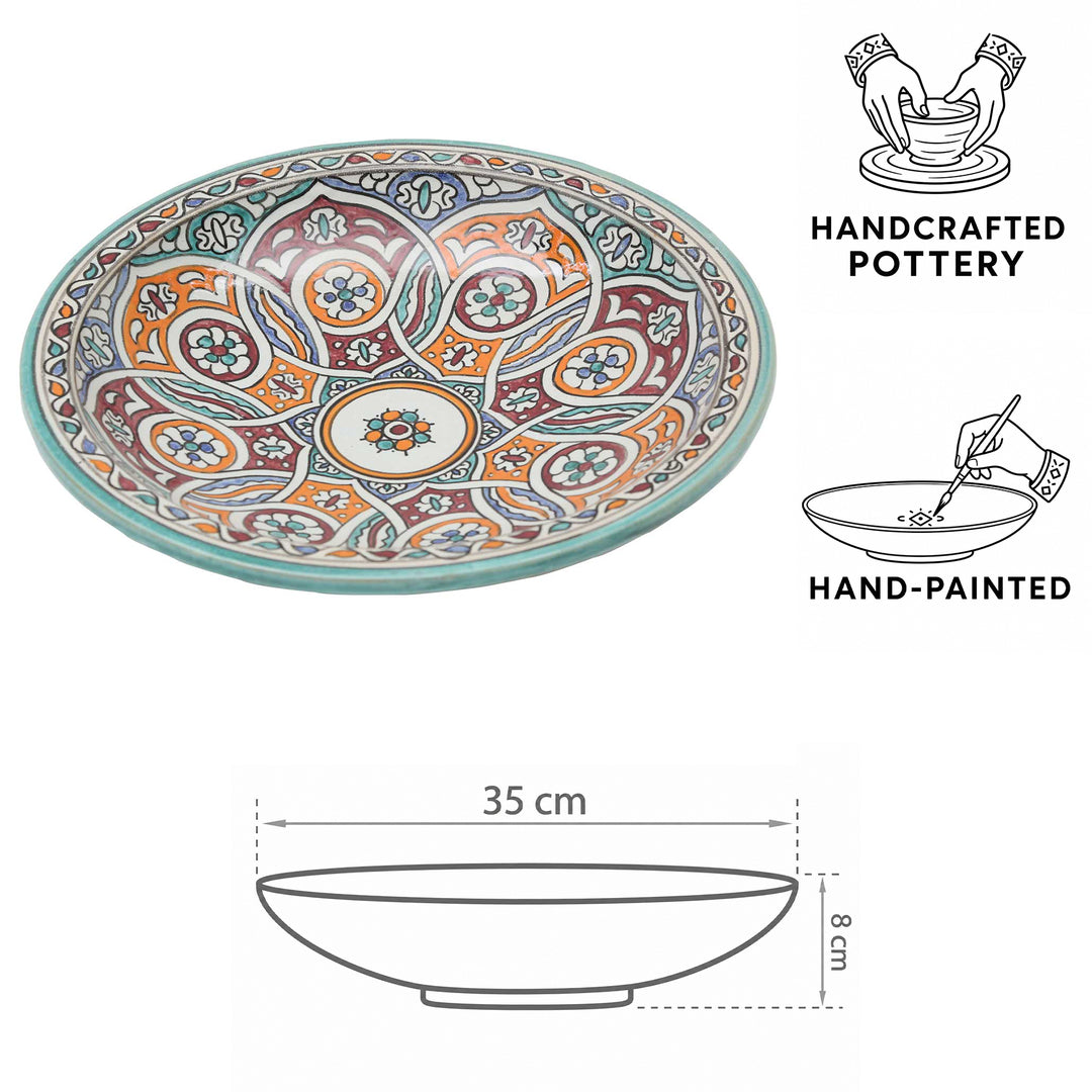 Handgeschilderde Marokkaanse keramische schaal met cirkelmotief in turkoois, oranje en bordeauxrood, Ø 35 cm en 8 cm hoog